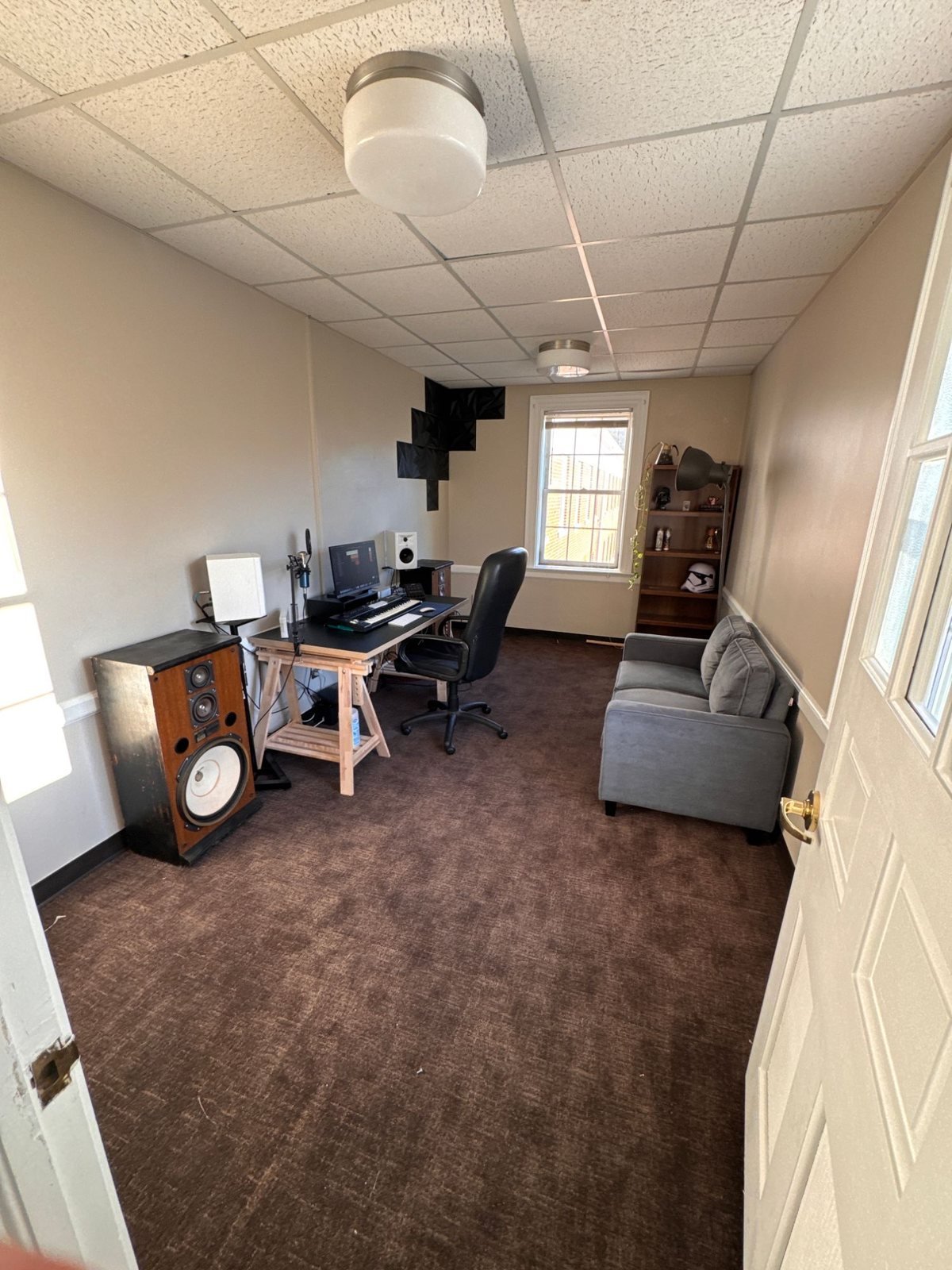 The Ghost Noise control room in Dalton, Georgia — desk, monitors, acoustic treatment and a couch
